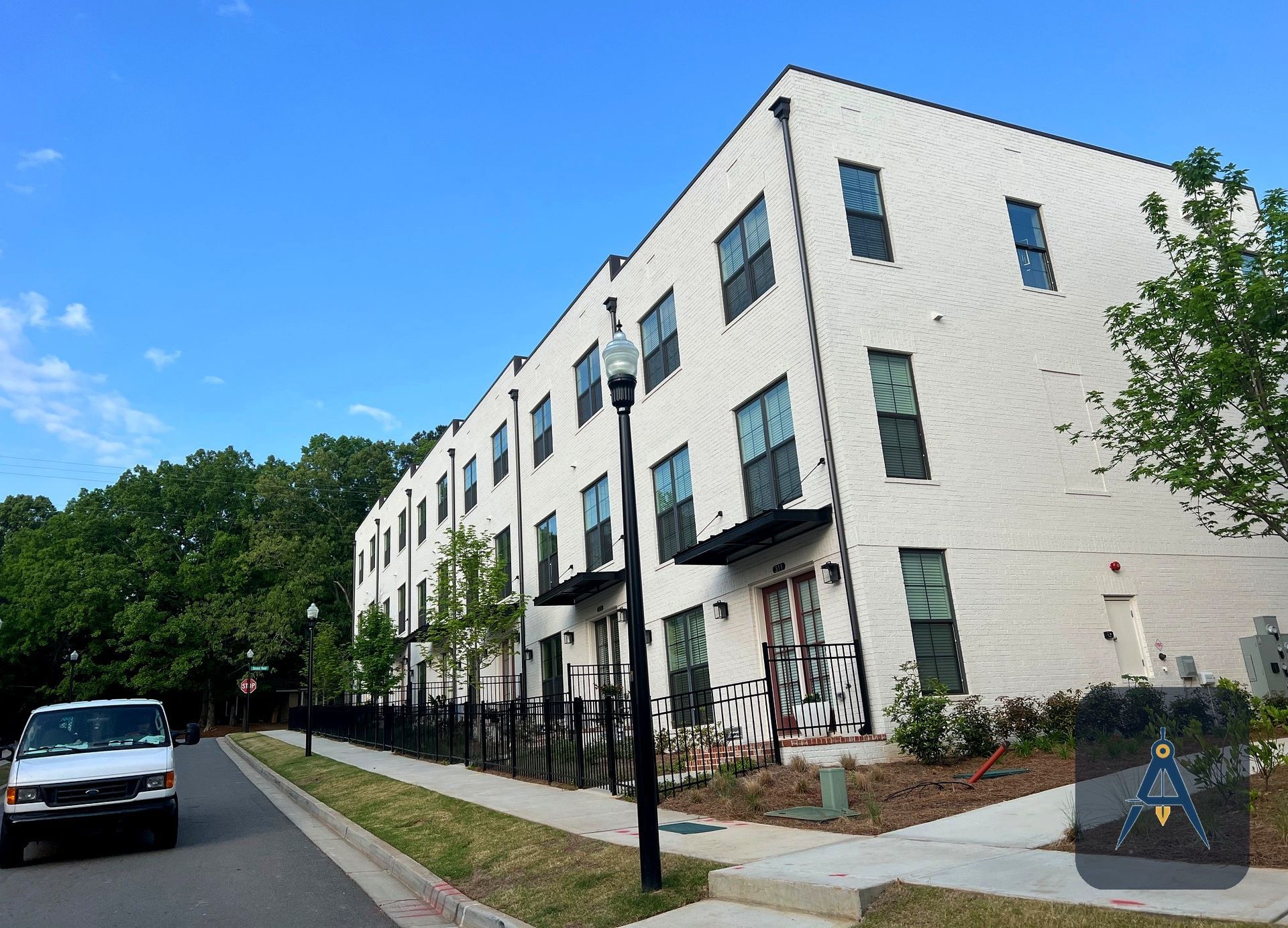 Completed multi-unit townhome new construction community built by Art Design & Construction in Woods