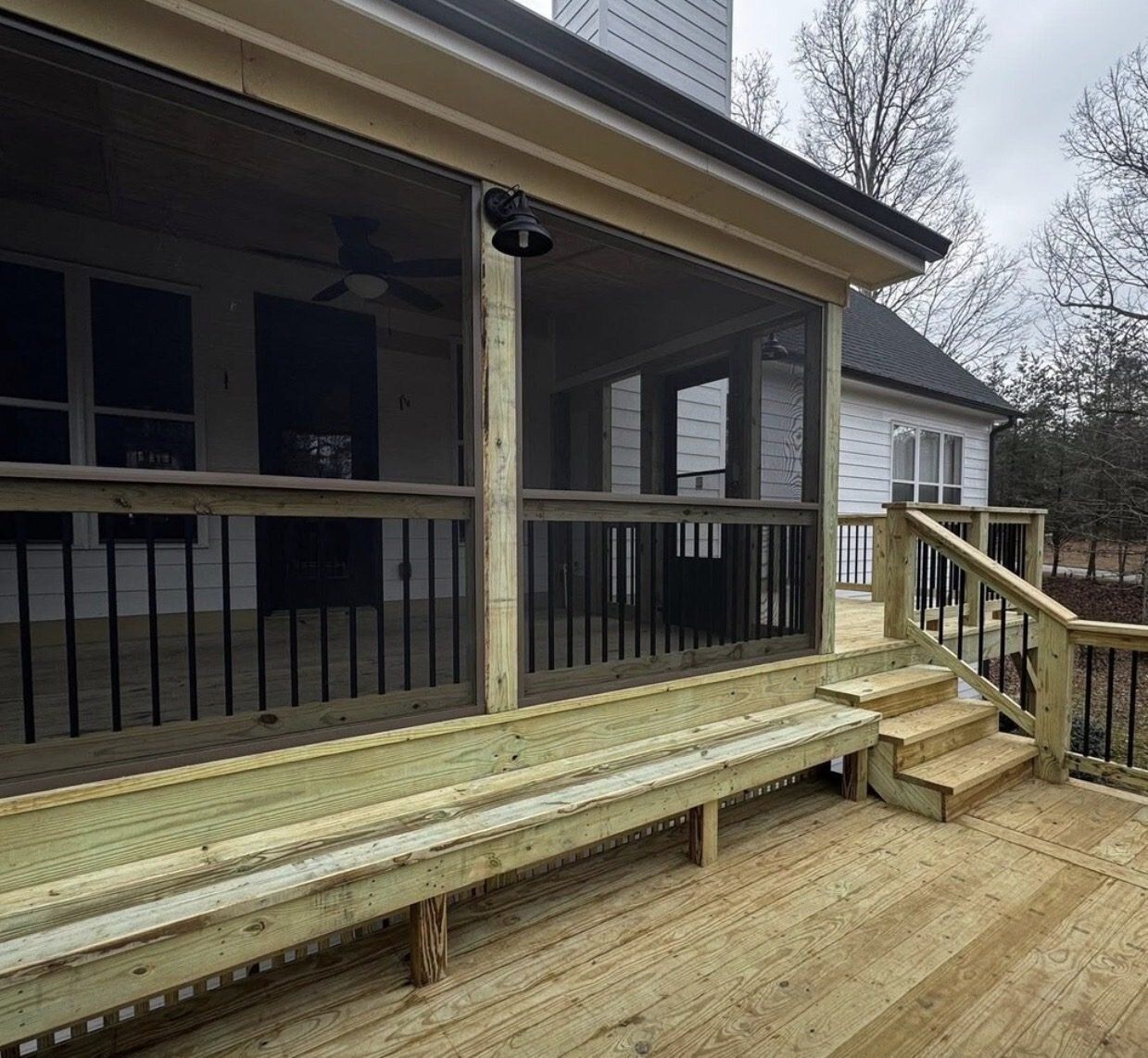 Screened porch with built-in bench seating and screen framing detail in Marietta, Georgia