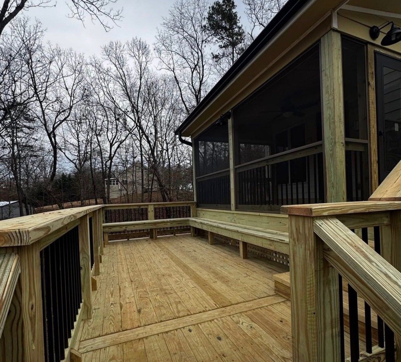 Completed screened porch with ceiling fan and privacy screening in Roswell, Georgia