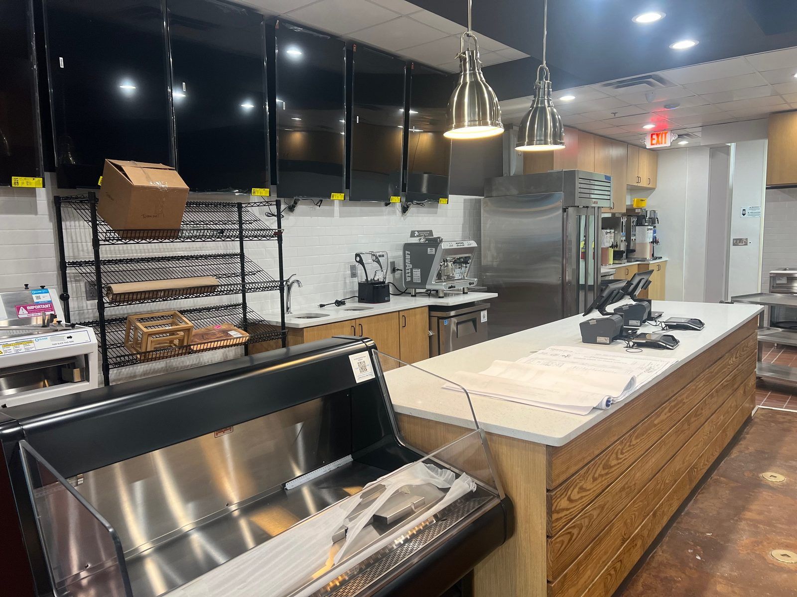 Commercial kitchen counter and equipment buildout with point-of-sale station completed by Art Design and Construction in Woodstock, Georgia