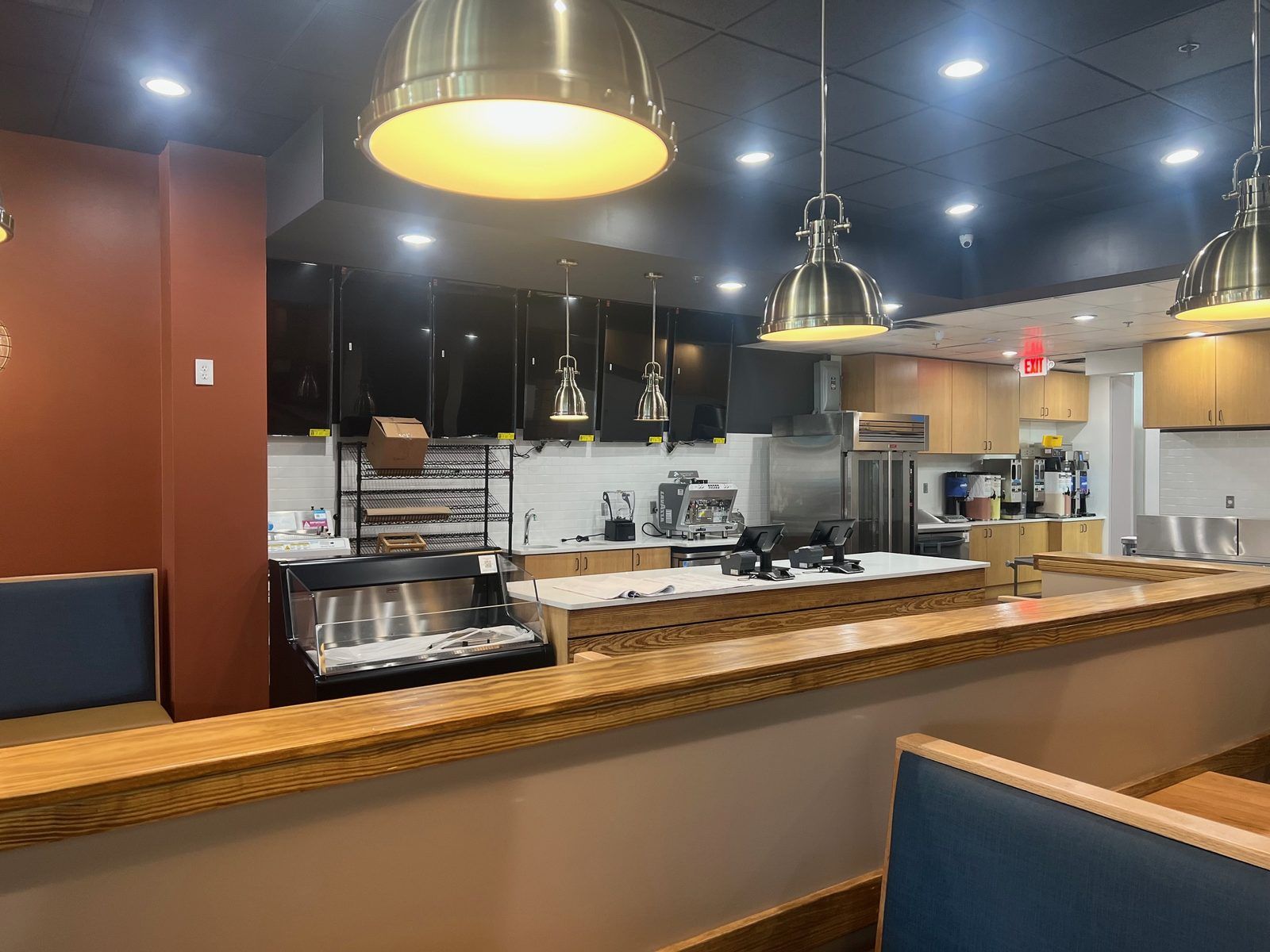 After Concrete floor staining in complete during a restaurant renovation Front of house after stained concrete flooring installation during restaurant remodel in Atlanta, GA