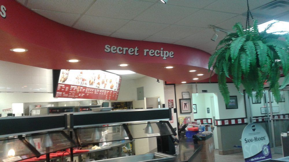 Retail storefront interior with illuminated menu signage and branded ceiling fascia coordinated during construction in Marietta, Georgia