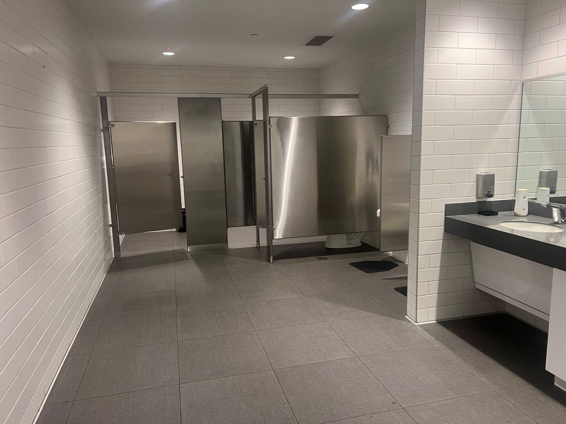 Finished commercial restroom with tile and fixtures for tenant finish-out in Woodstock, Georgia