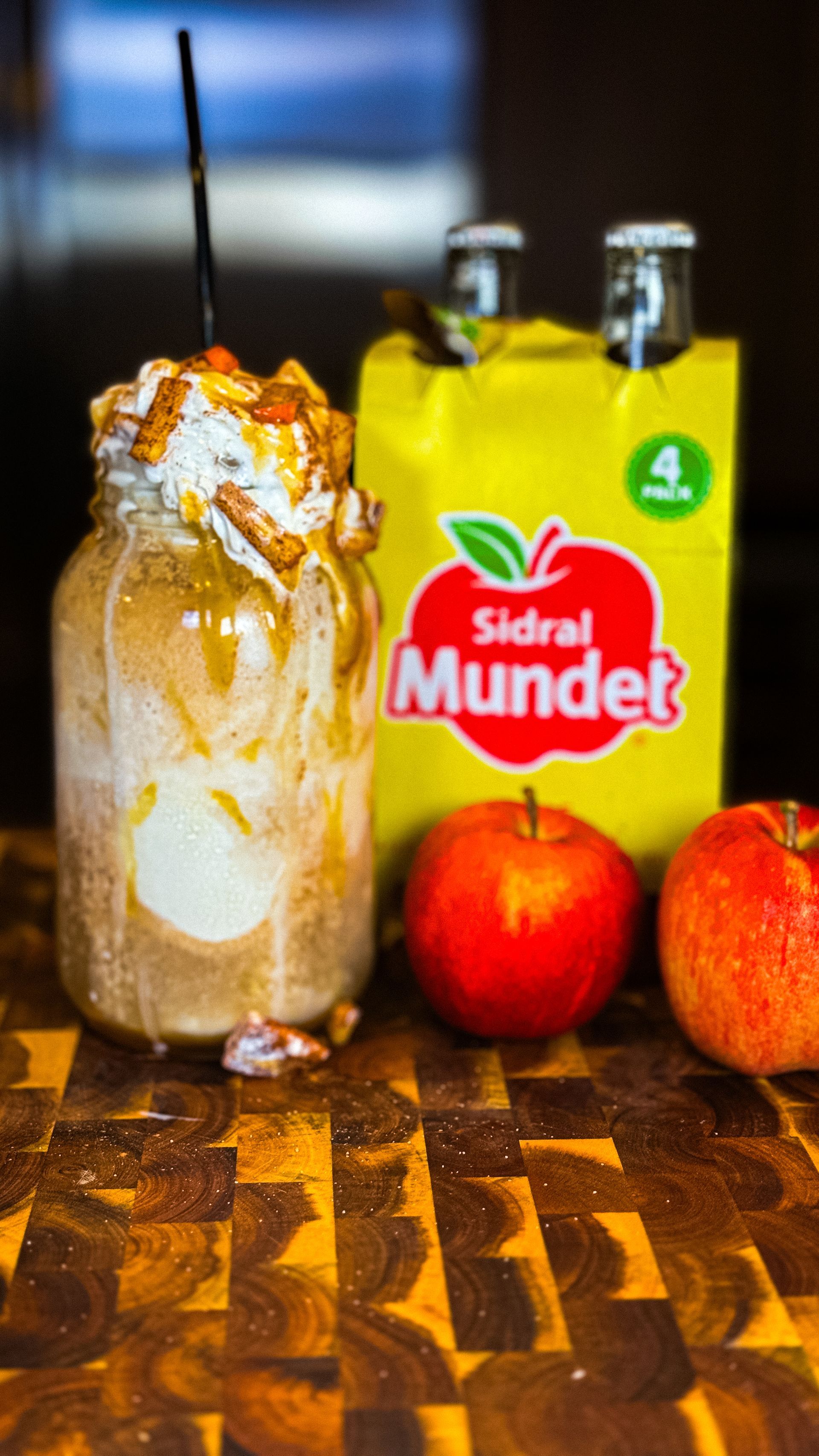 Mason jar milkshake with toppings, apple cider, apples, and Sidral Mundet in a 4-pack.