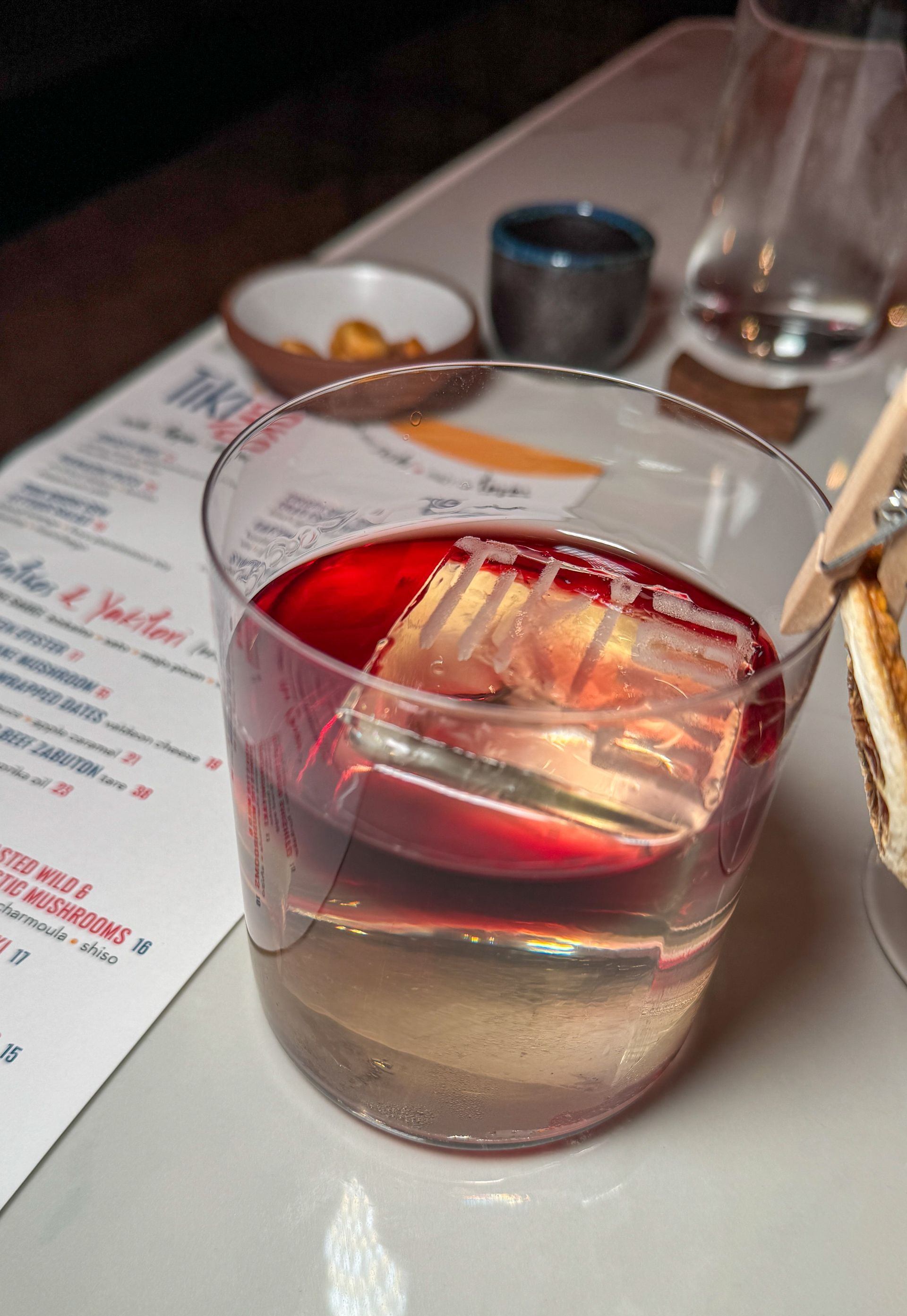 A close up of a glass of liquid on a table