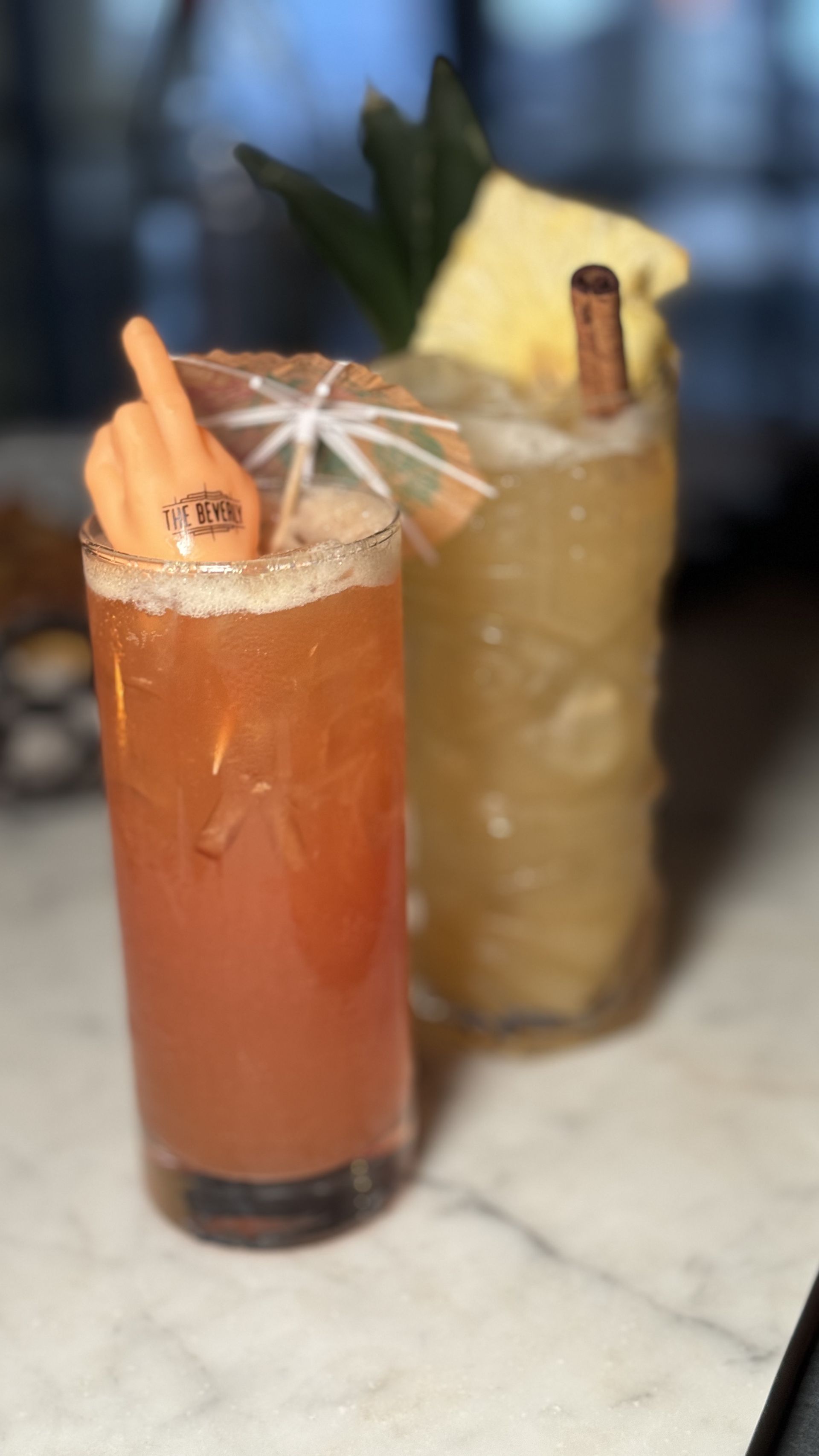 The Beverly - A couple of drinks are sitting on a table.