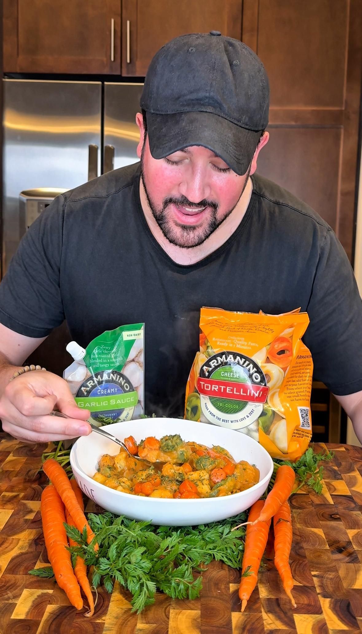 A bowl of salsa and tortilla chips on a wooden cutting board.