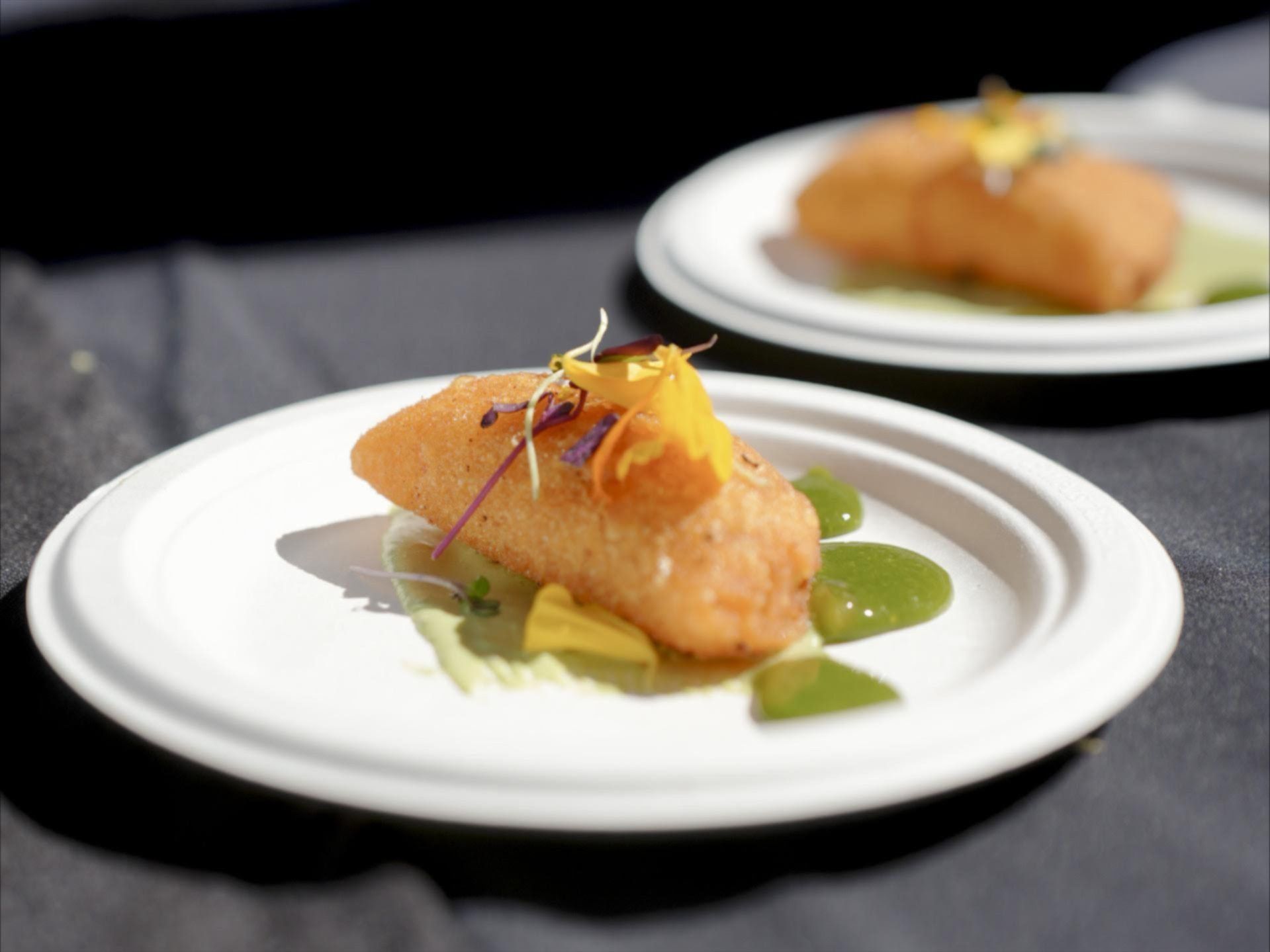 A white plate with a piece of food on it