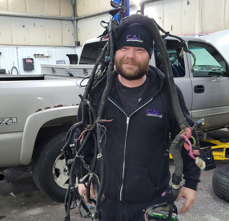 Mechanic repairing a car | CAL Automotive