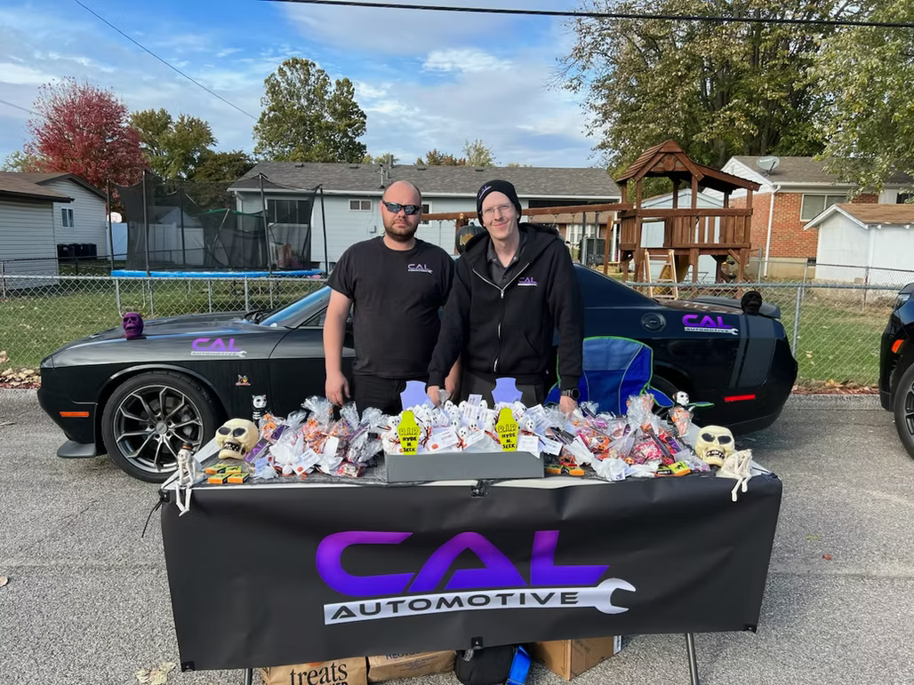 Two persons standing next to each other | CAL Automotive