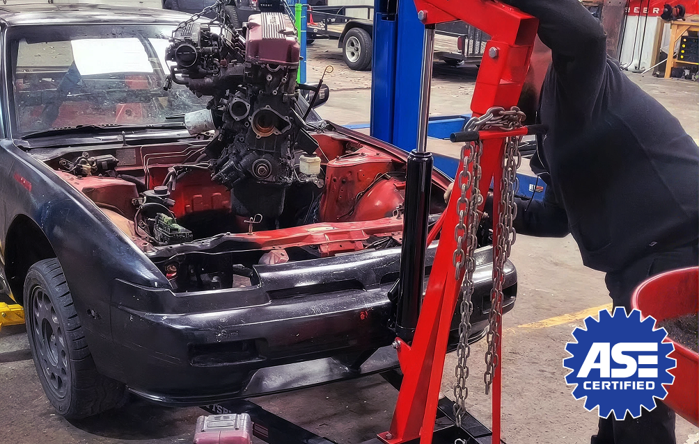 Mechanic working on a car | CAL Automotive