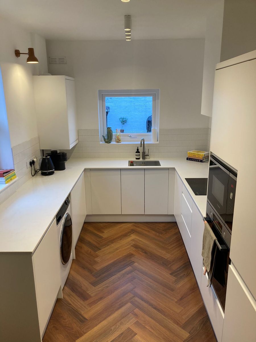 Full kitchen installation with fitted units and appliances