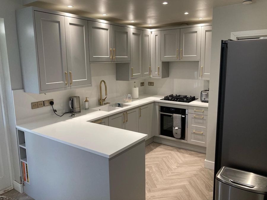 Kitchen renovation with integrated fridge freezer and gas hob