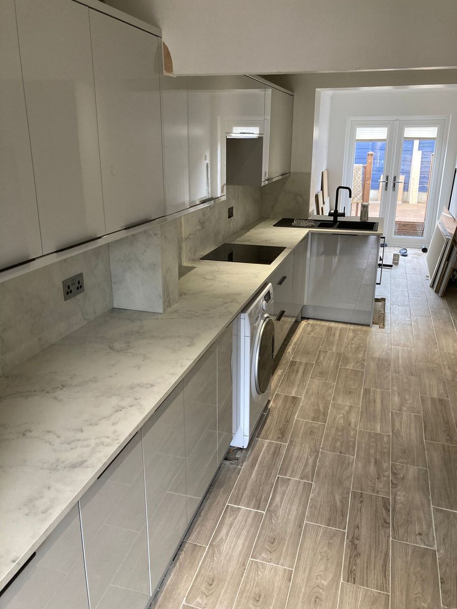 Full kitchen renovation with fitted units and worktops