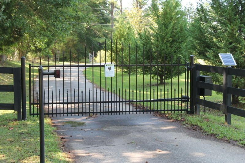 black metal gate with keypad