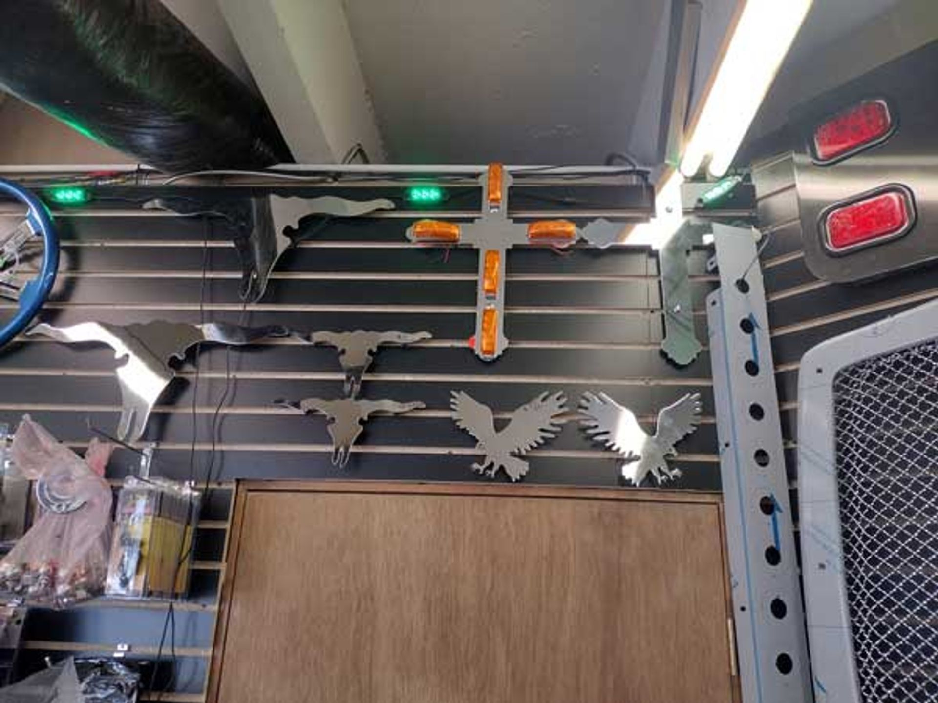 A wall with a cross and eagles on it