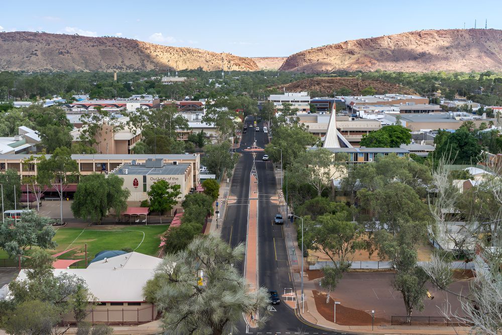 An Aerial View Of A City With Mountains In The Background — Frontier Cement Supplies In Alice Springs, NT