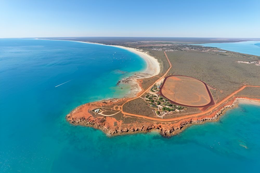 An Aerial View Of A Small Island In The Middle Of The Ocean — Frontier Cement Supplies In Broome, NT