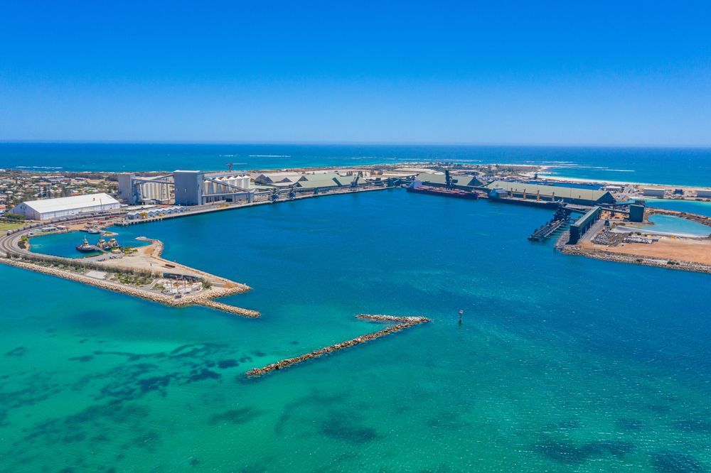 An Aerial View of a Large Body of Water With a City in the Background — Frontier Cement Supplies In Geraldton, NT