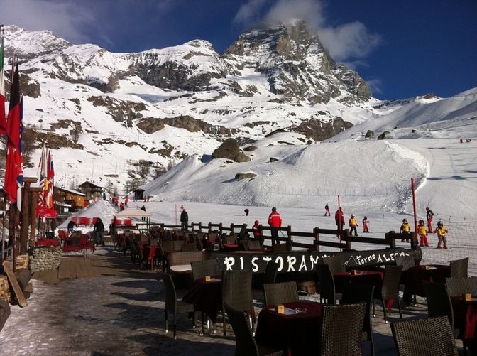 Outdoor tables with a view of the Matterhorn Mountain