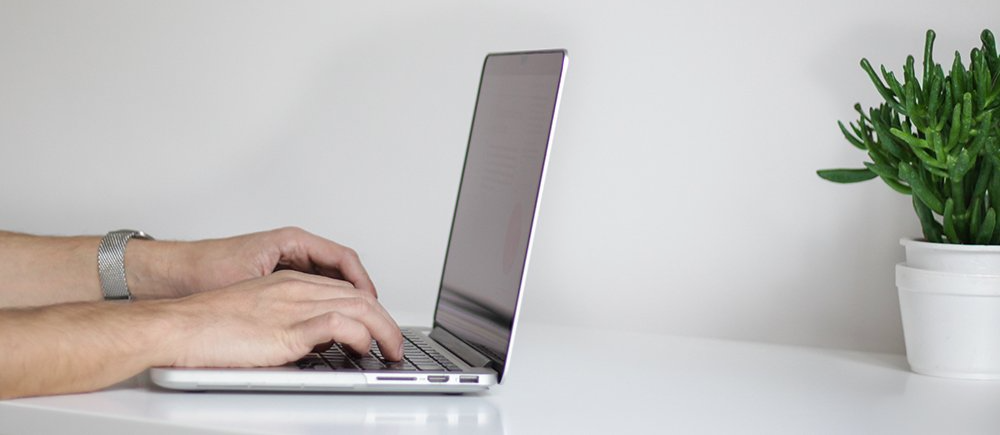computer image and linked to resident portal login page