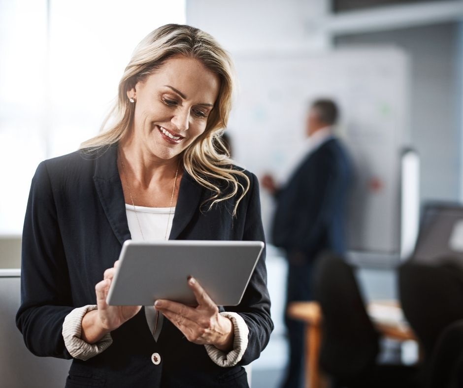 Professional woman uploading probate documents on a tablet
