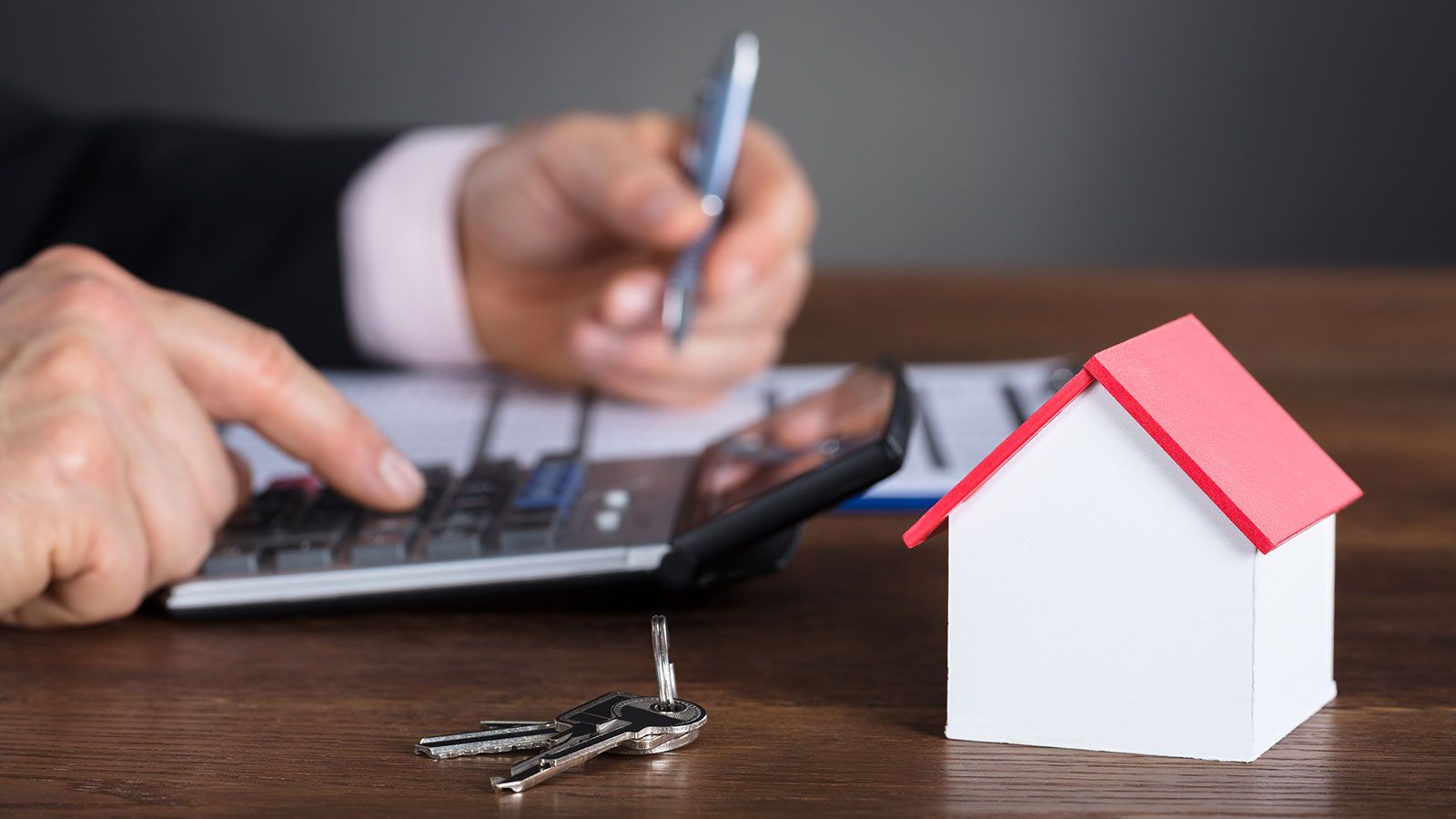 Man Calculating House Loan