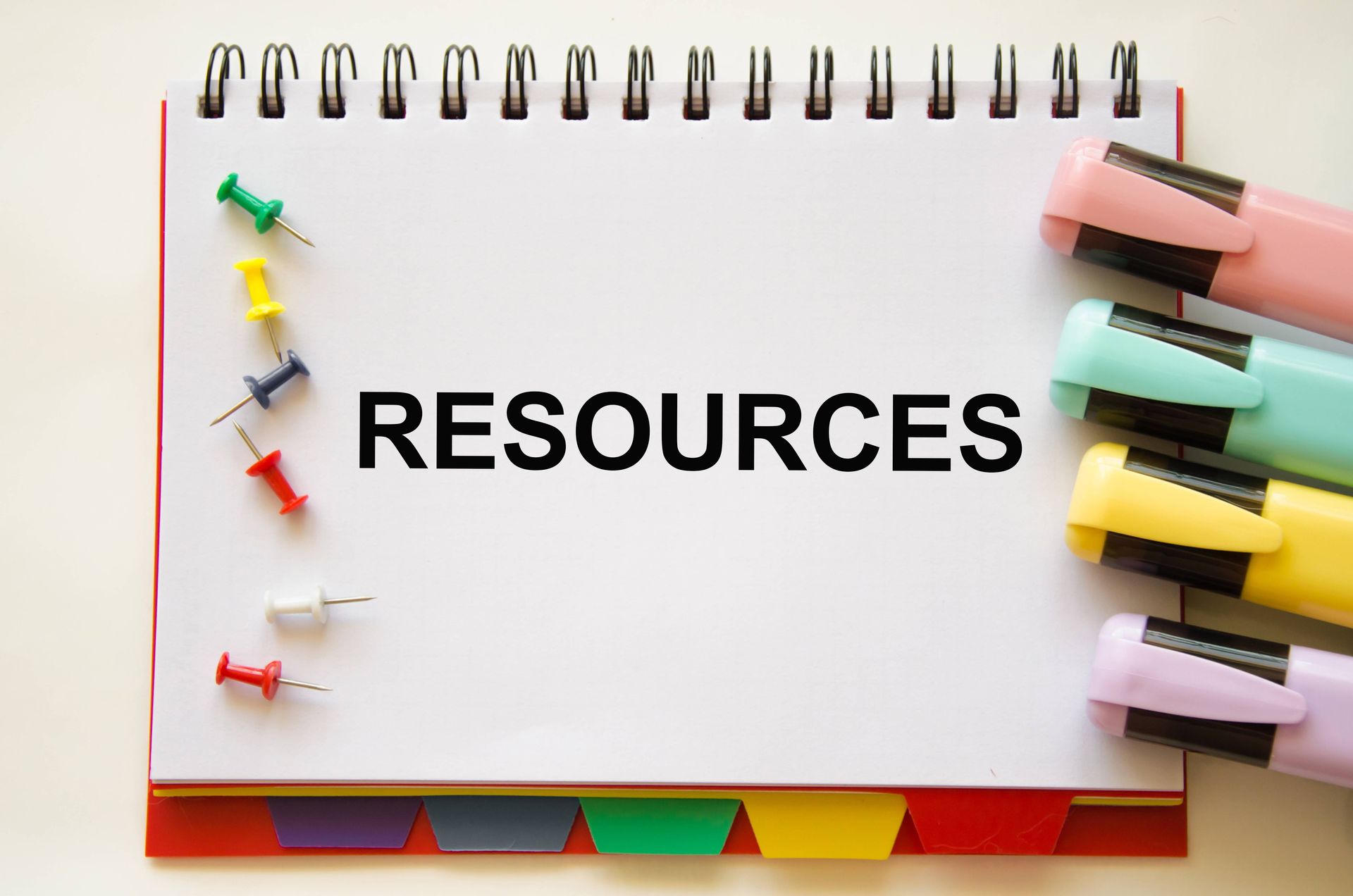 A notebook with the word resources written on it