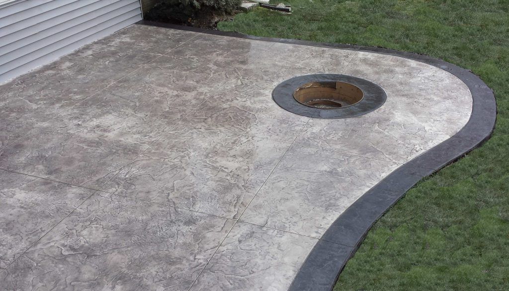 Nice and fancy patio with circular fireplace — Cedar Rapids, IA — Earthworks Concrete