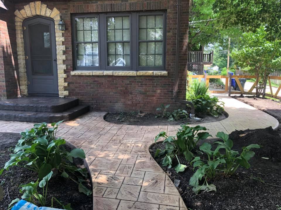 Ashlar tile stamp with almond slate stairs — Cedar Rapids, IA — Earthworks Concrete