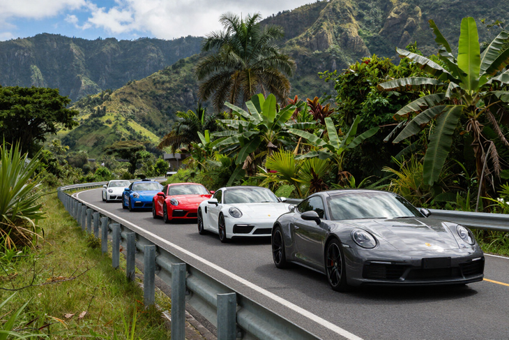 Porsche convoy on a mountain road