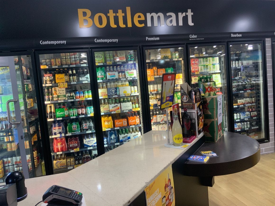 Bottle Shop Interior With Refrigerated Drink Displays — Capricorn Tavern in Taranganba, QLD