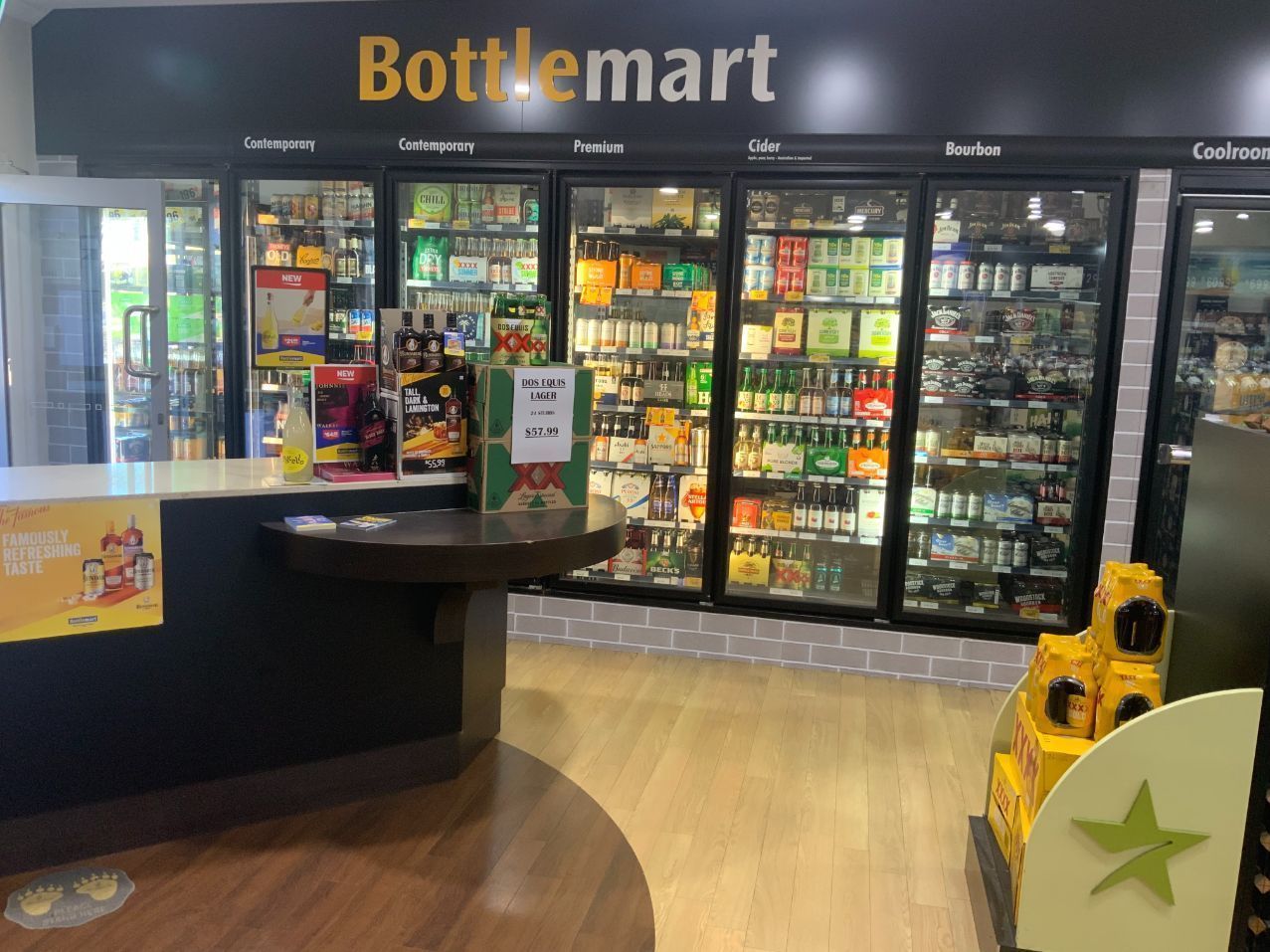 Bottle Shop Interior With Refrigerated Alcohol Displays — Capricorn Tavern in Taranganba, QLD