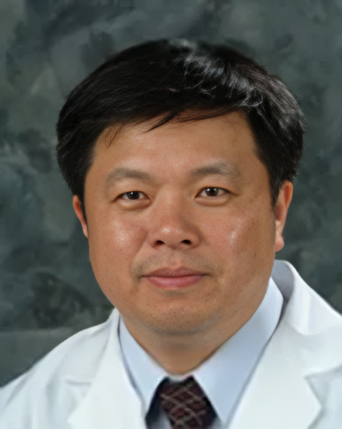 A person in a white medical coat and light blue shirt against a dark, mottled background.
