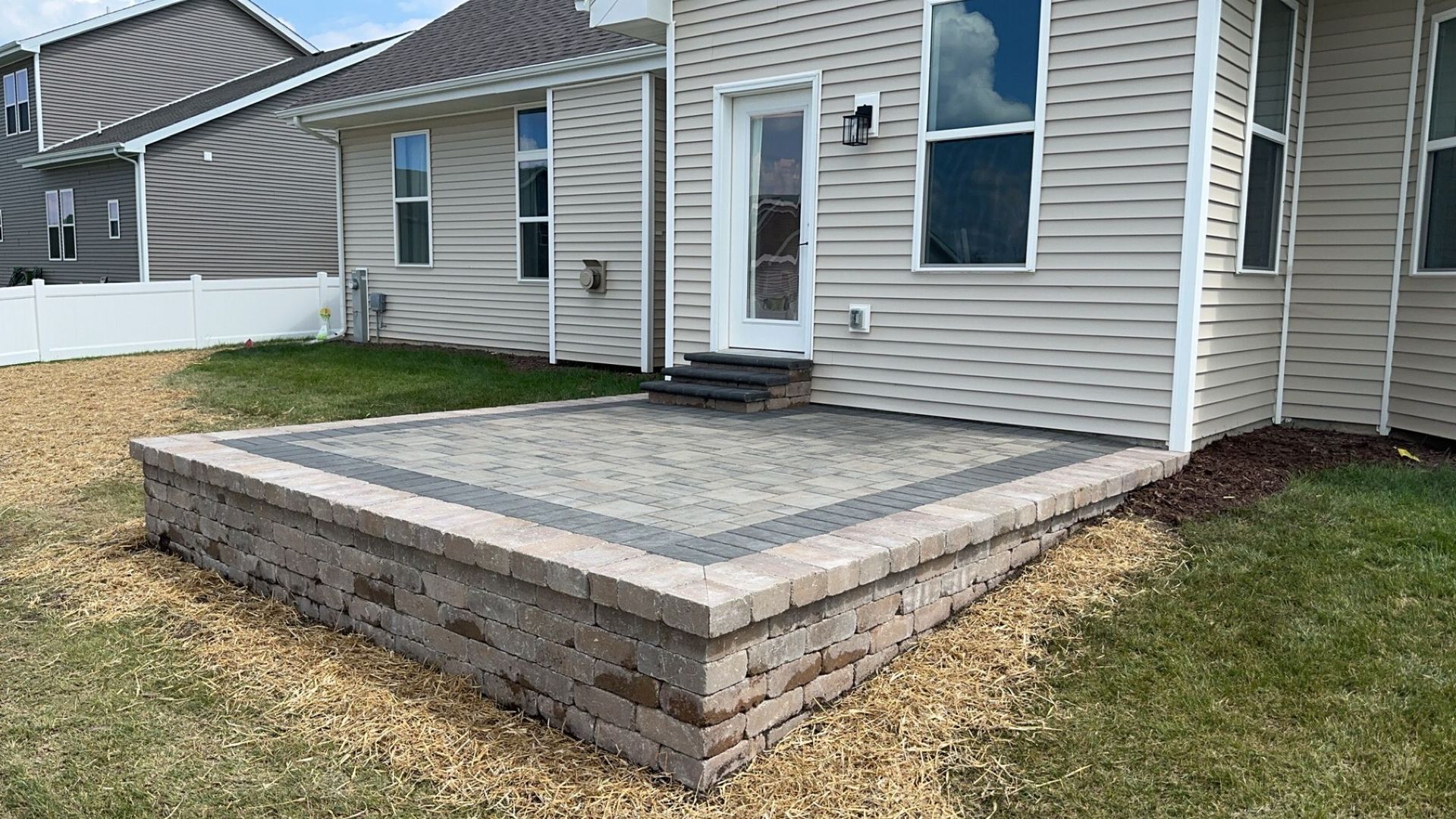 Paver walkway and backyard outdoor living area in Southern Wisconsin