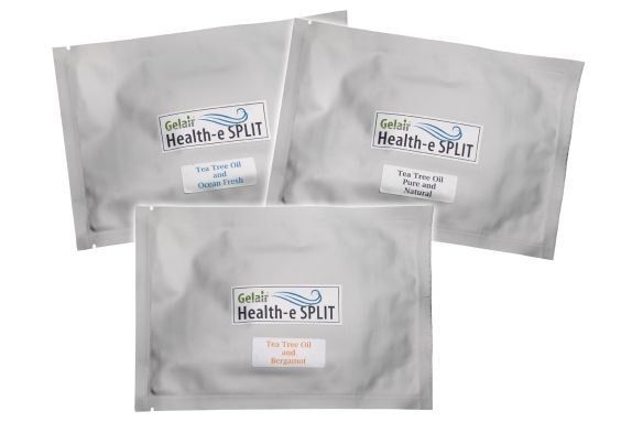 Three sealed, silver-colored packets labeled