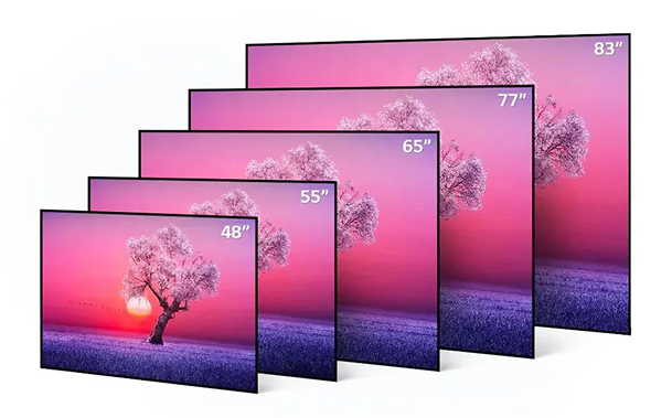 Stacked flat-screen TVs showing a pink-purple sunset landscape with different screen sizes.
