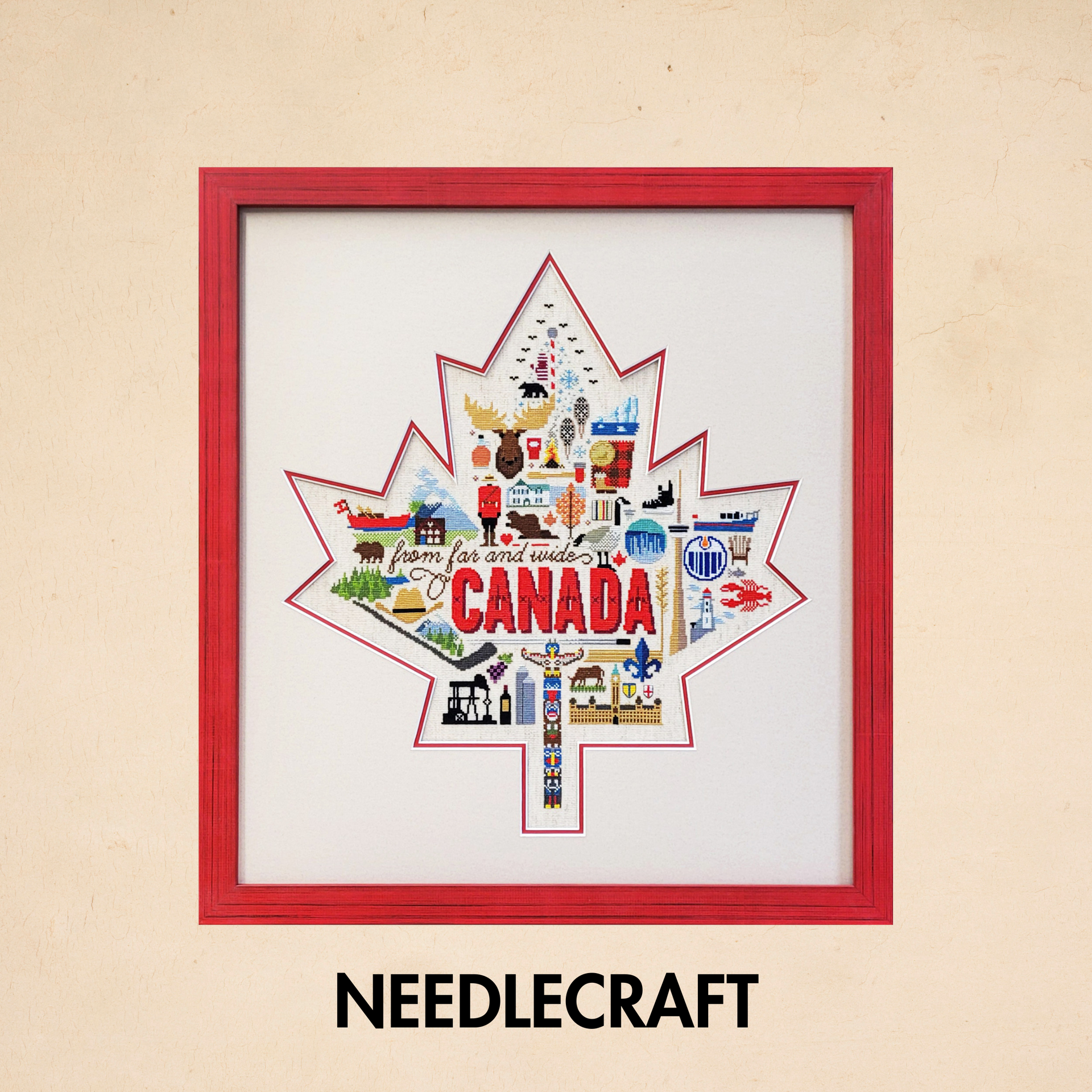 Red-framed maple leaf needlecraft art with colorful Canada collage and the word “CANADA” center