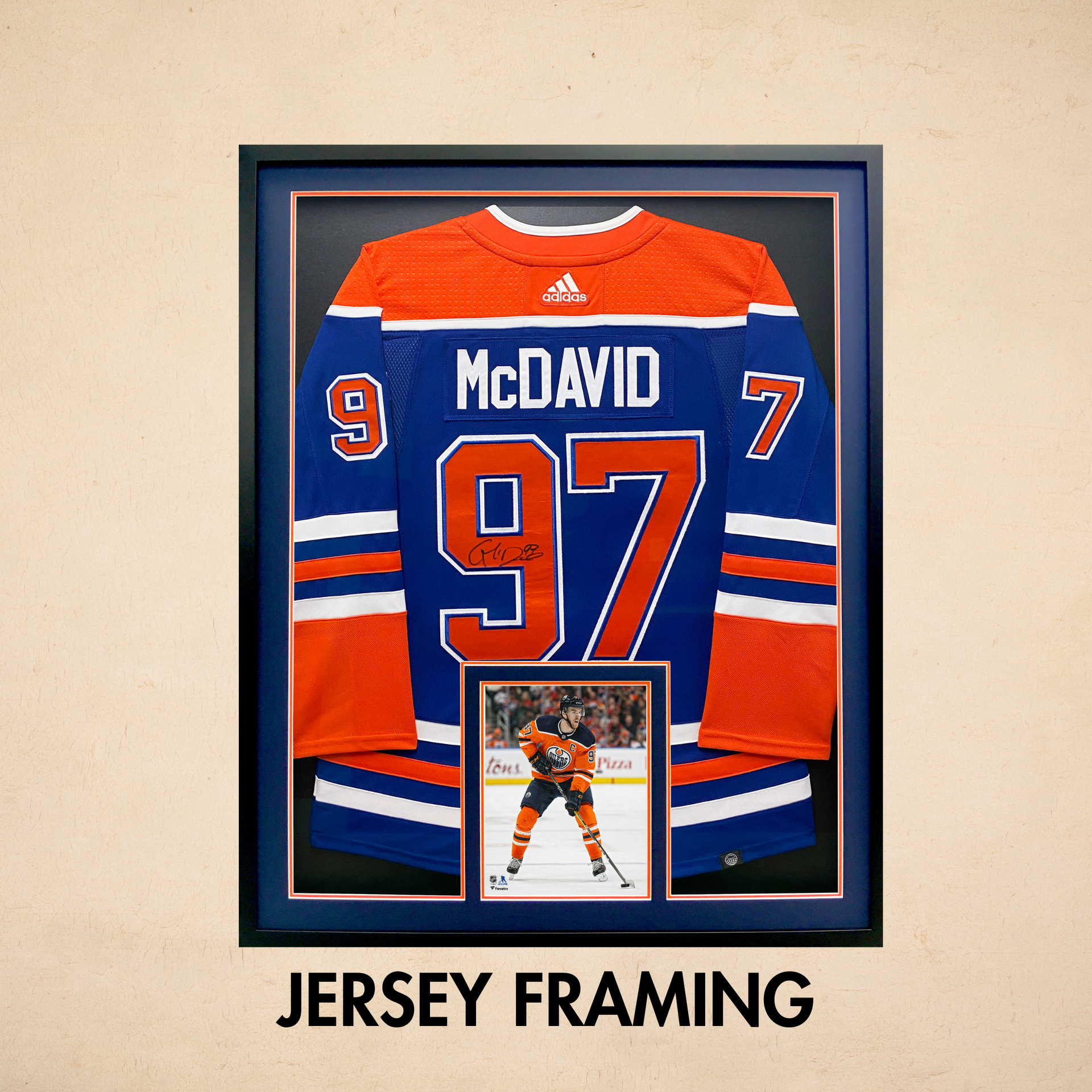 Framed Edmonton Oilers McDavid #97 jersey in blue and orange with a small photo inset below