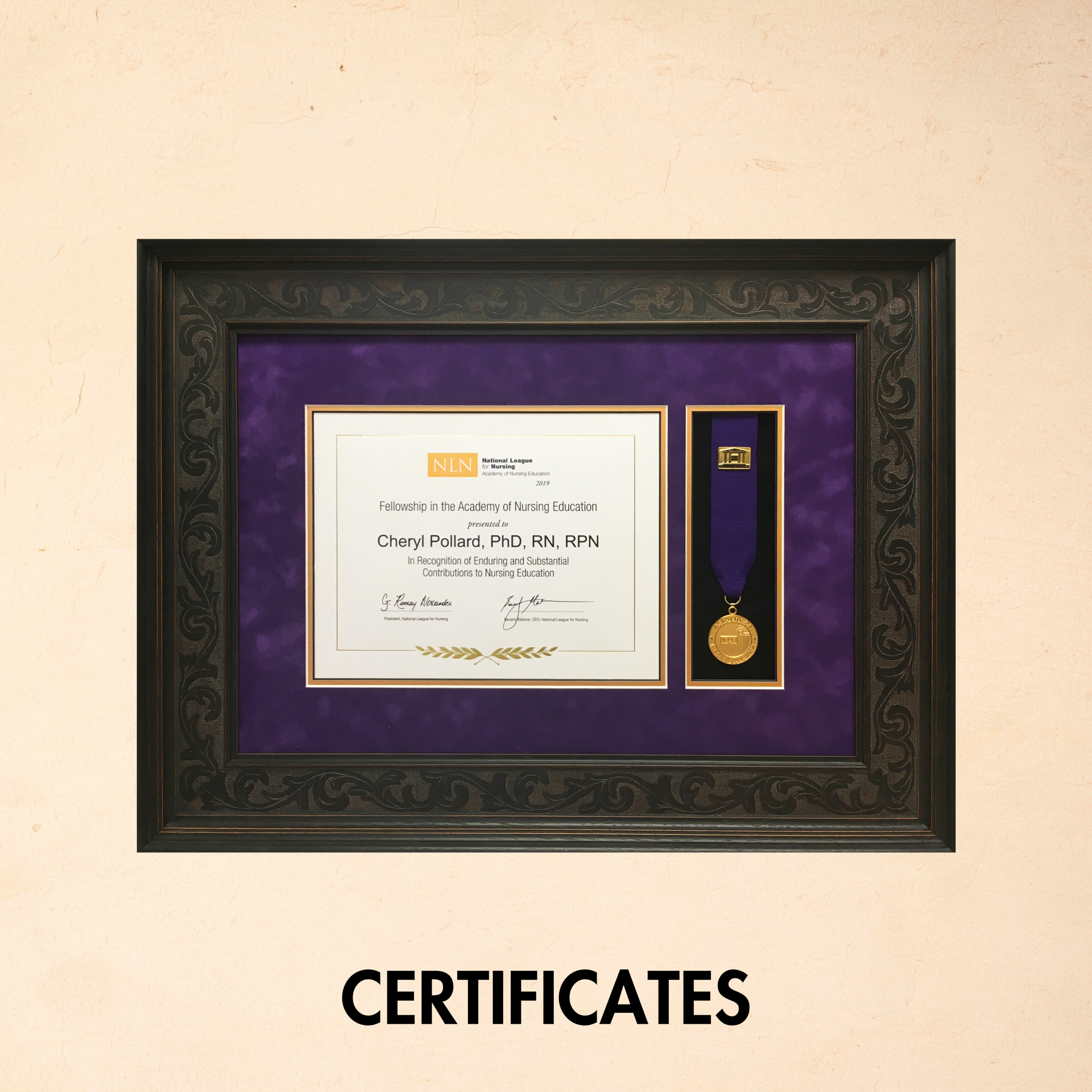 Framed certificate and medal in a black frame with purple mat, labeled “CERTIFICATES” below.