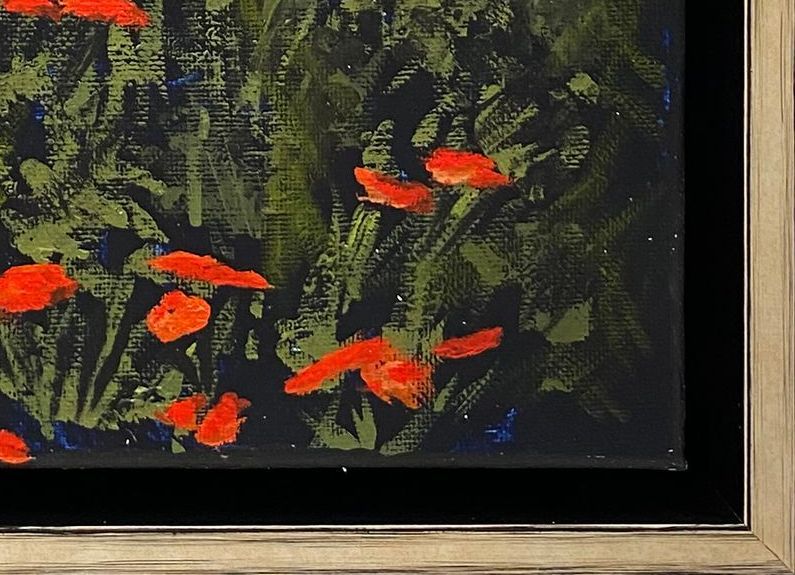 A framed painting of red flowers on a black background