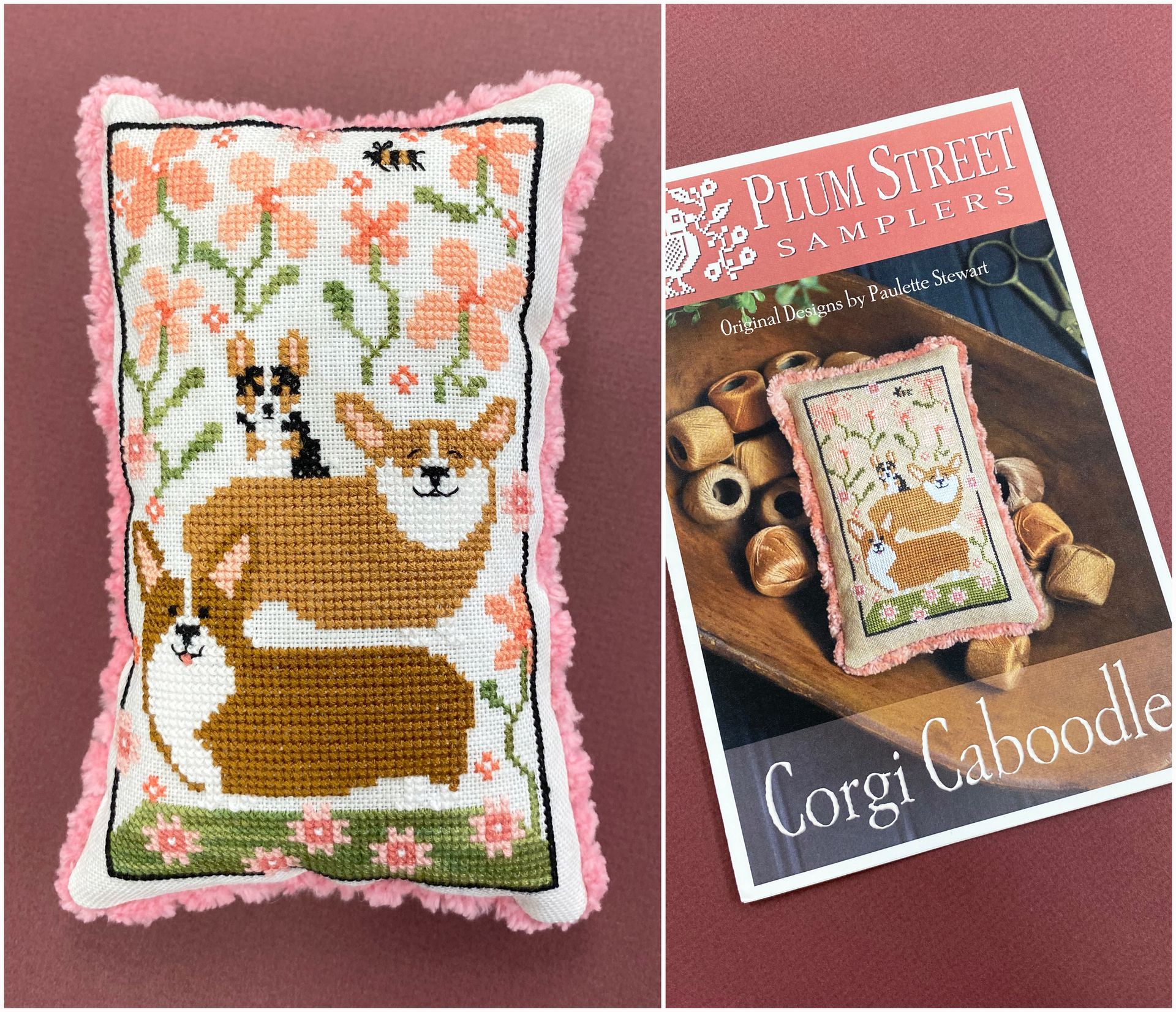 Pink plush pillow with a stitched corgi on a floral front beside a Corgi Caboodle pattern booklet.