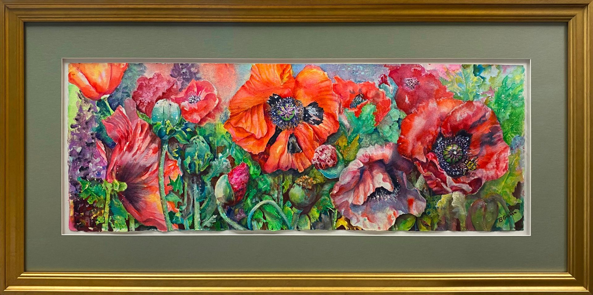 Vibrant red floral artwork displayed in a gold frame