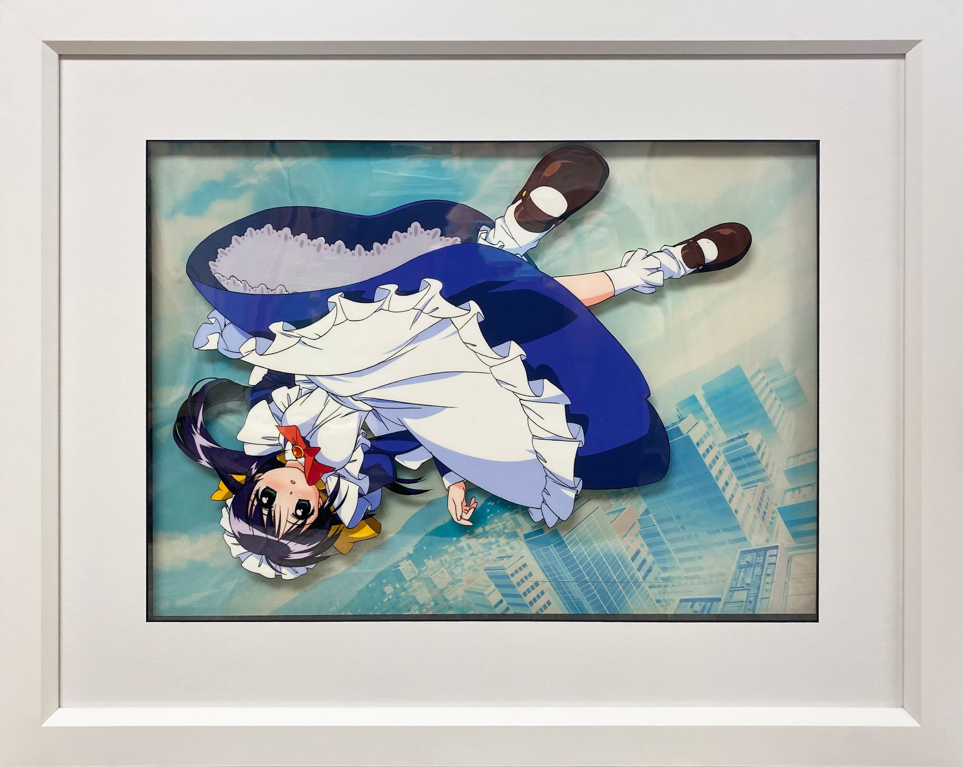 a framed photo of an anime character floating