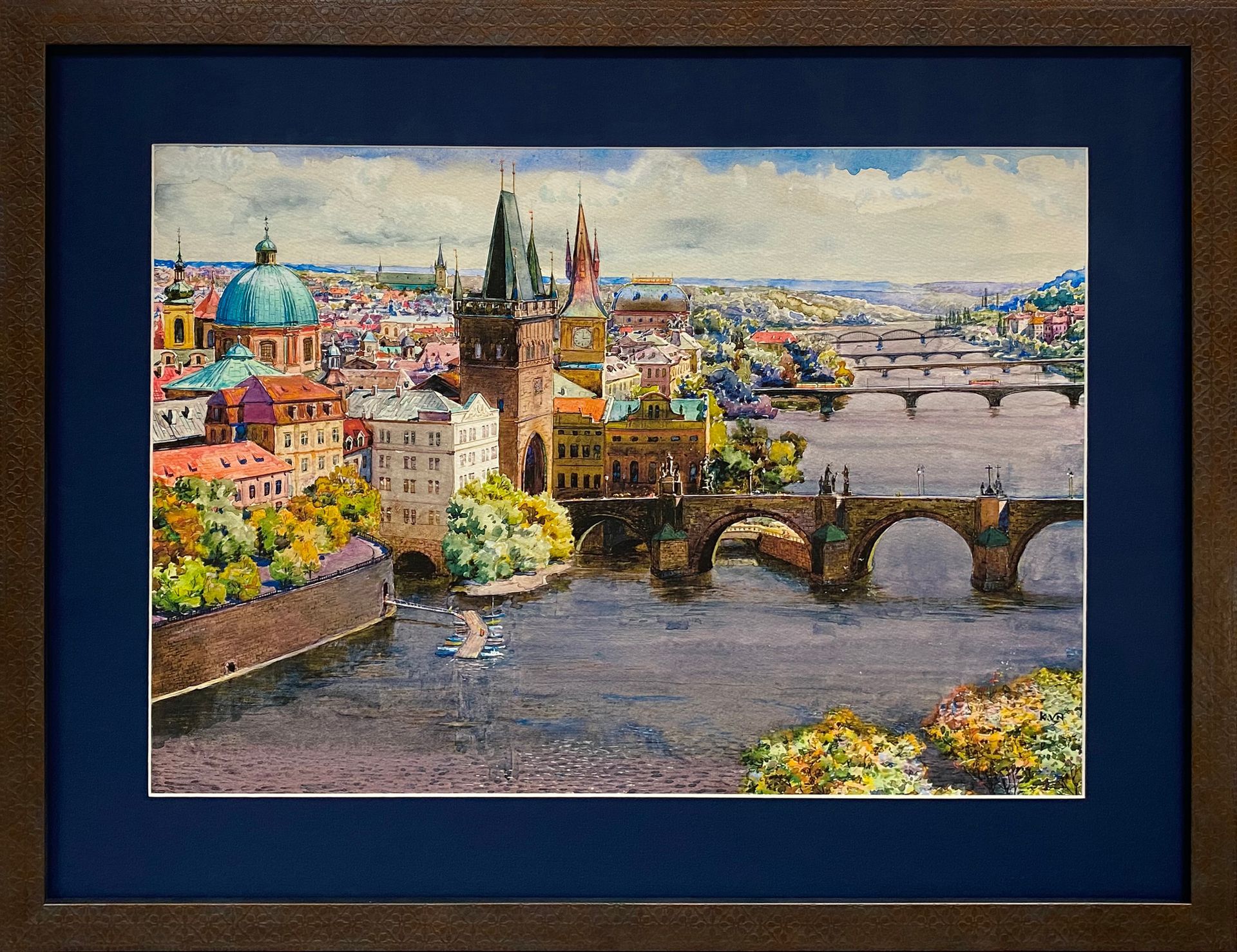 European cityscape artwork with a river and historic buildings in a black custom frame