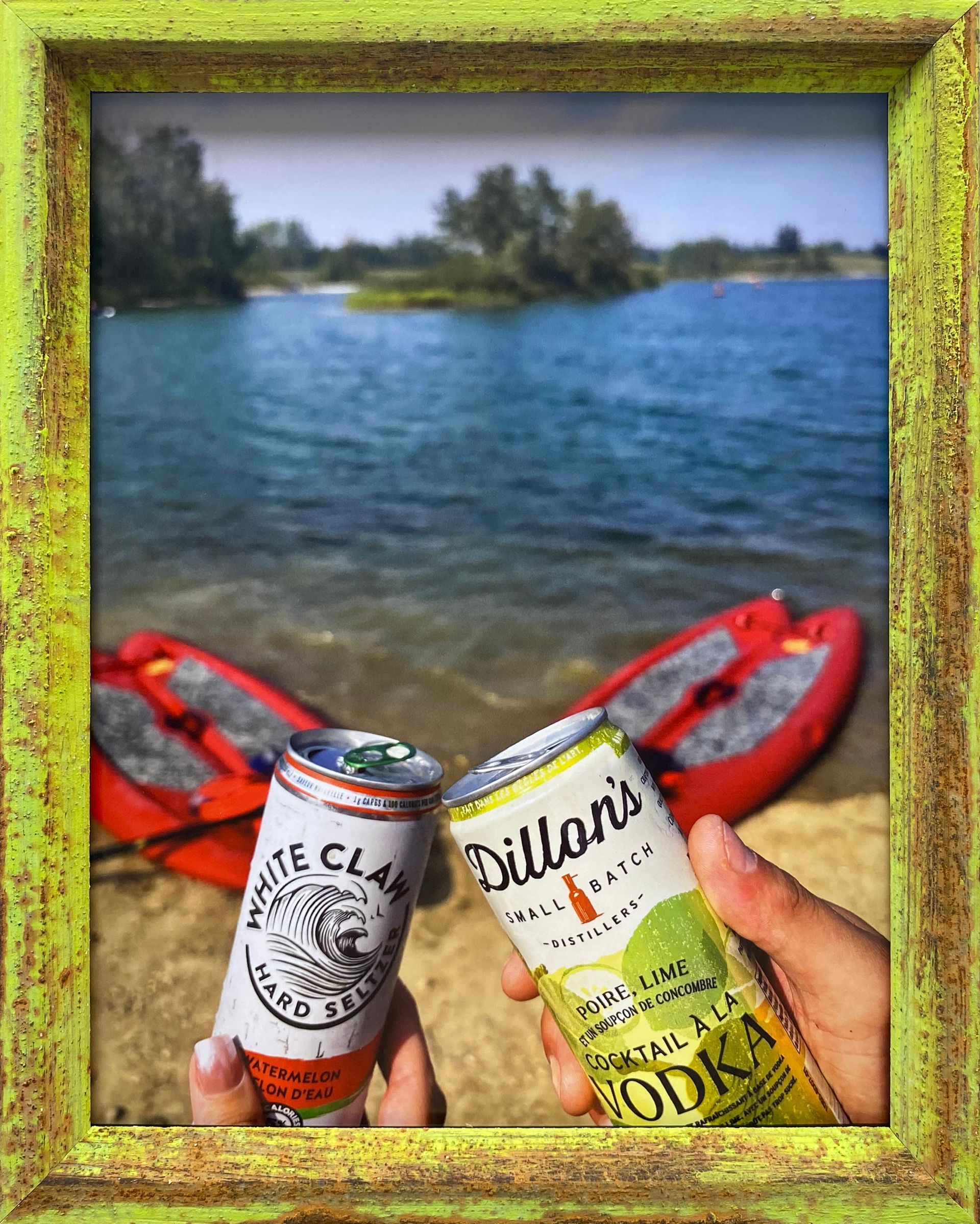 a yellow framed photo of drinks on the lake