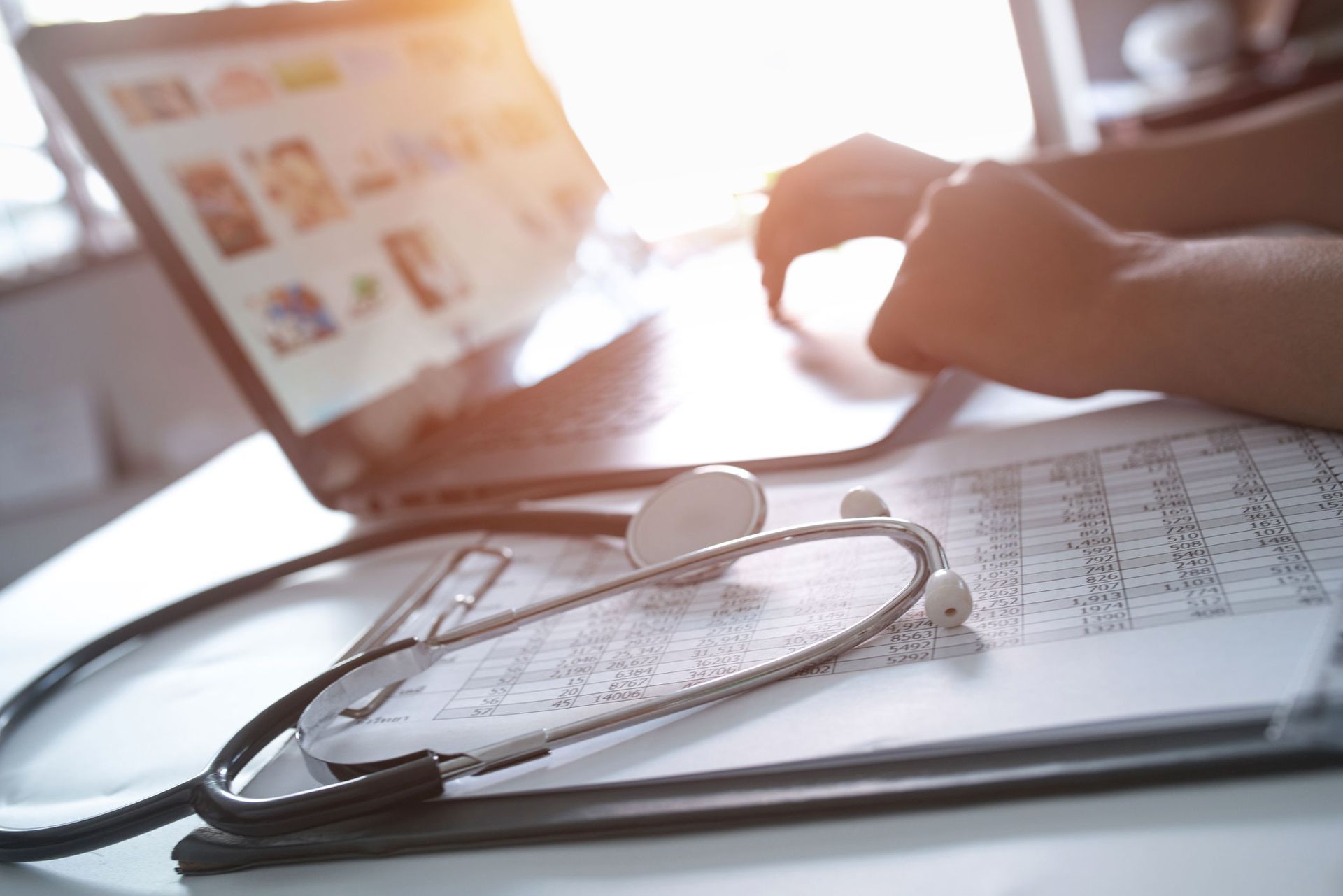 Nurse Typing On Laptop | Chicago, IL | Francisco L. Chuy, MD