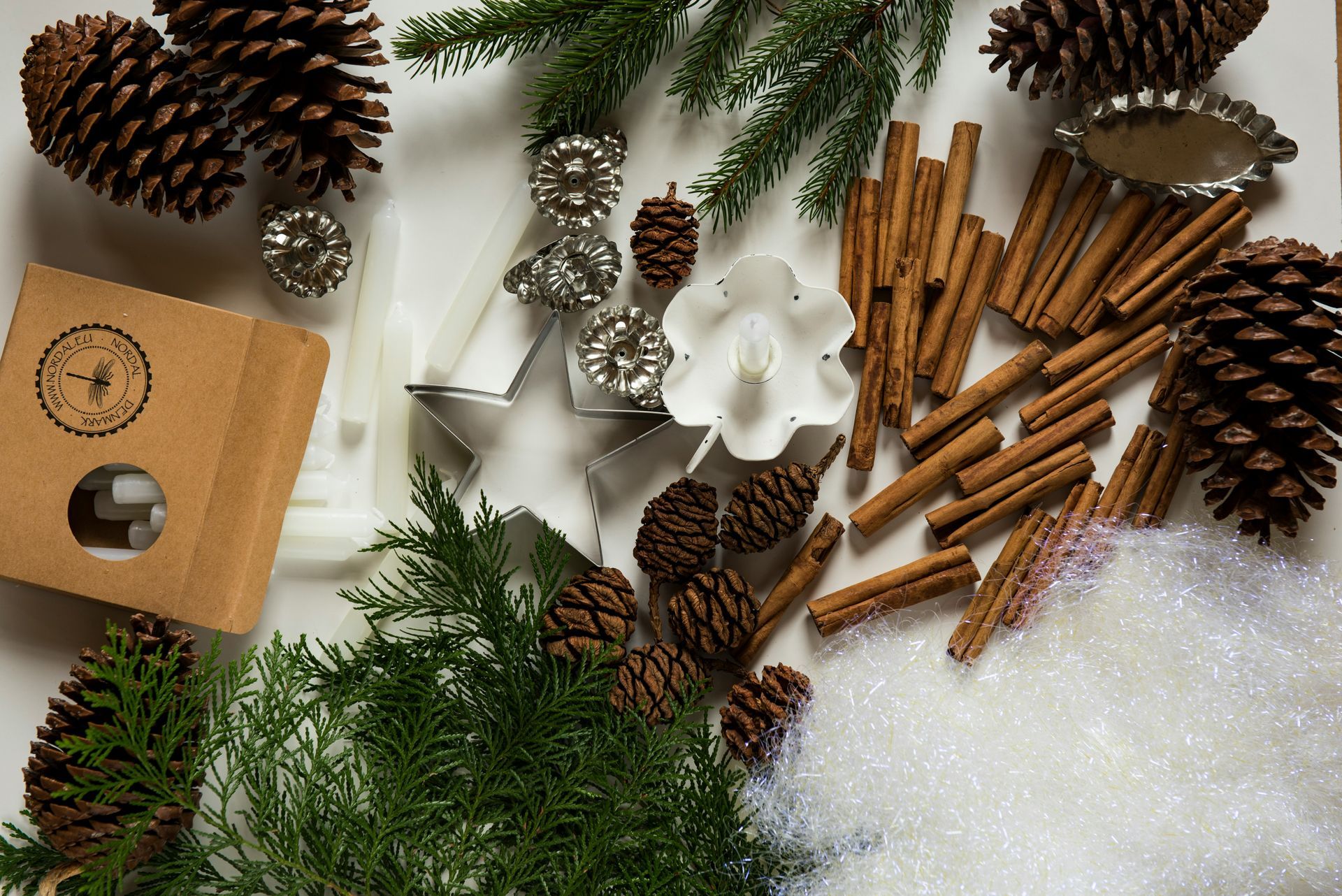 holiday things like pincones, cinammon sticks on table