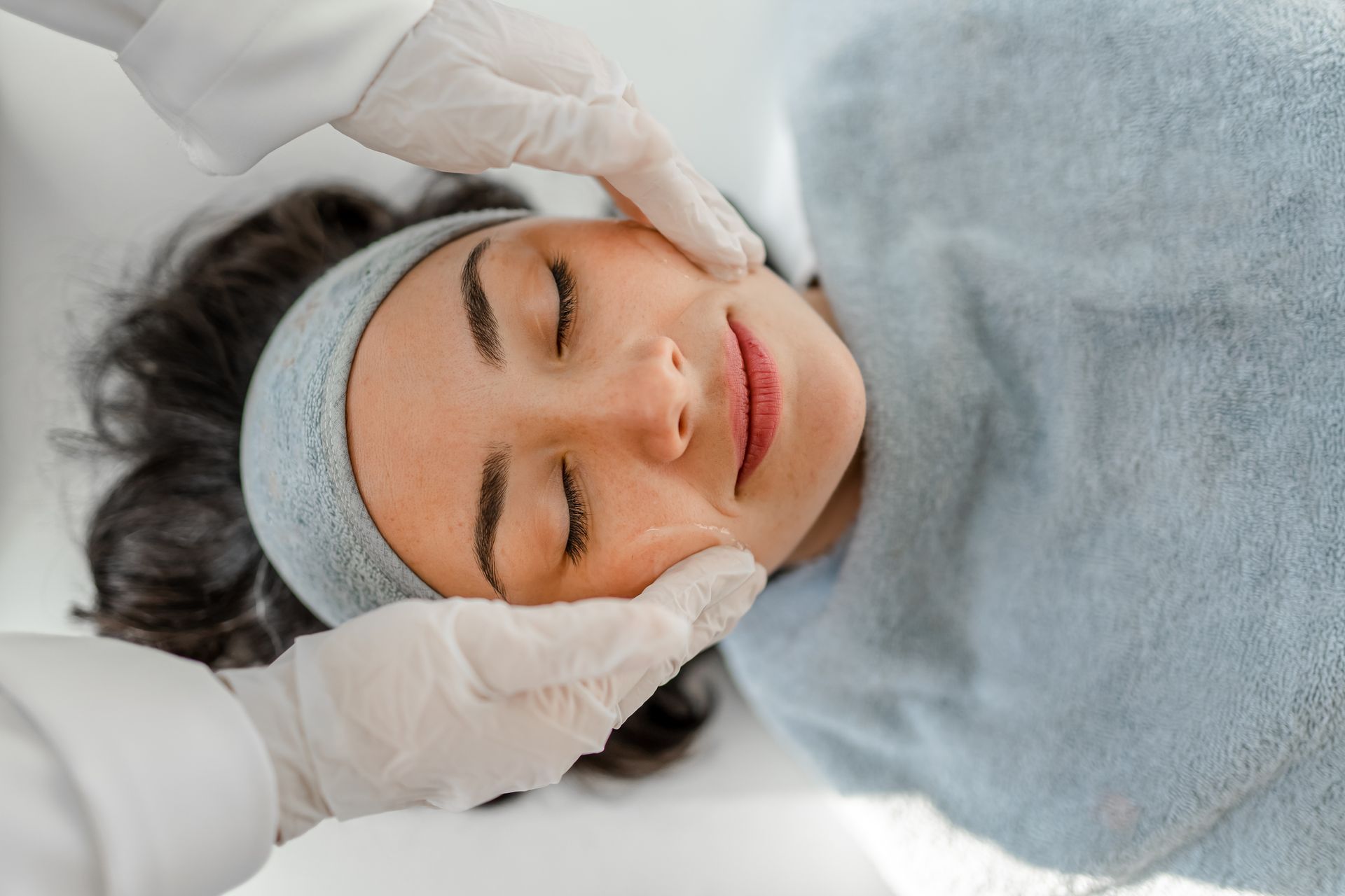 A woman receiving a beauty treatment. A woman receiving a beauty treatment.