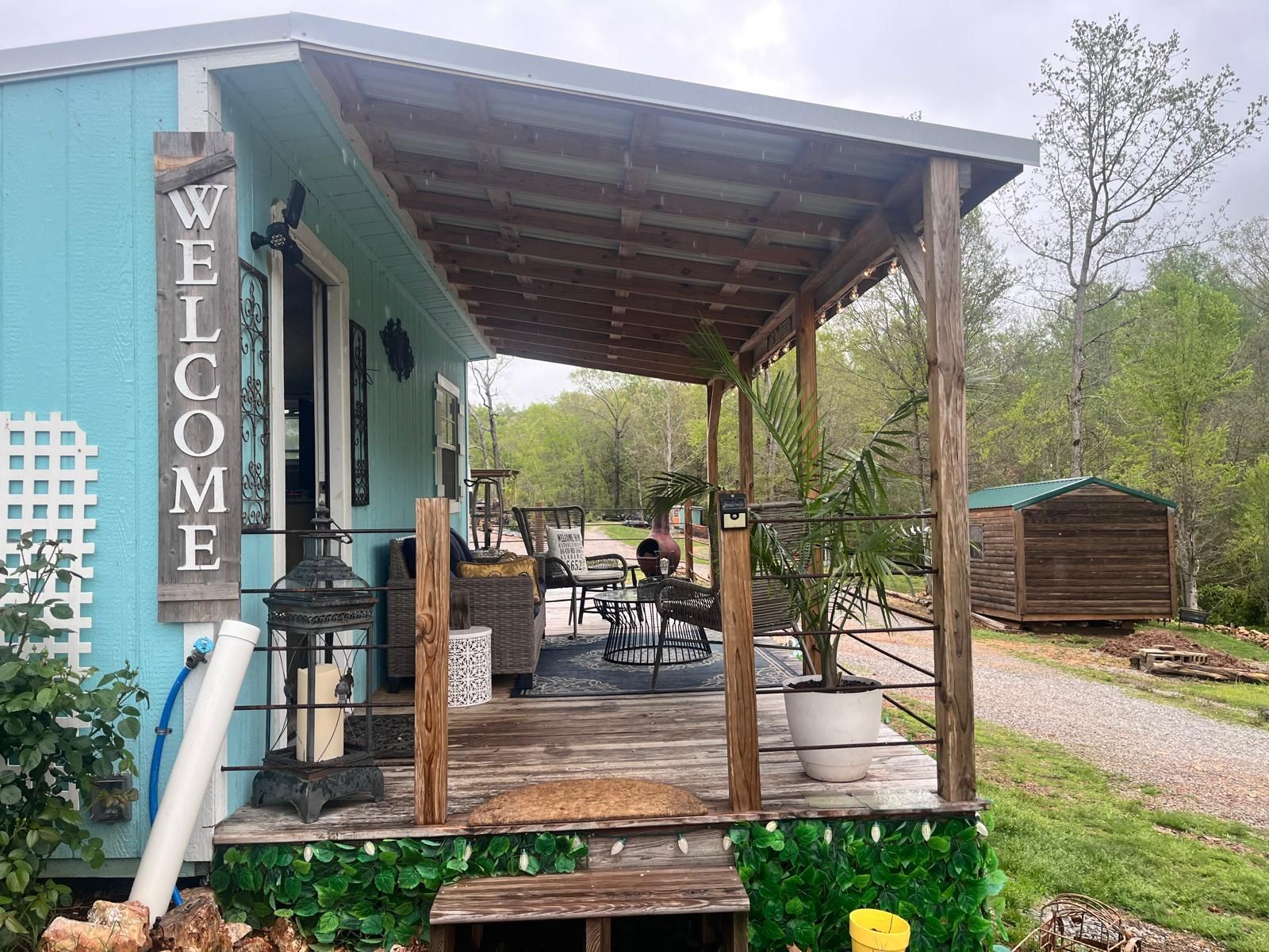 Blue house with wooden porch, 